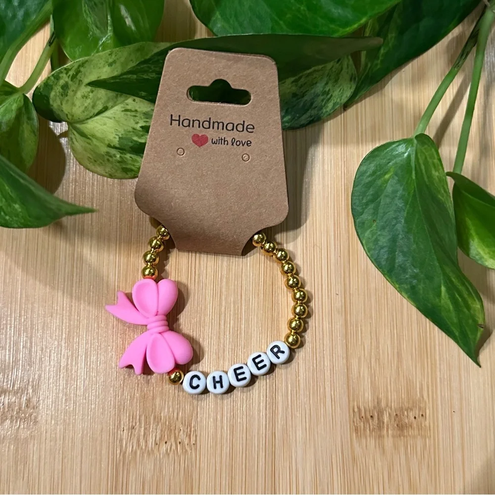 Gold Kids’ Stretchy Beaded Cheer Bracelet | Handmade | Silicone Bow 📣✨ - Picture 1 of 1